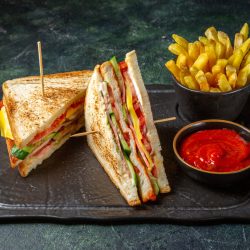 front-view-tasty-ham-sandwiches-with-french-fries-dark-surface